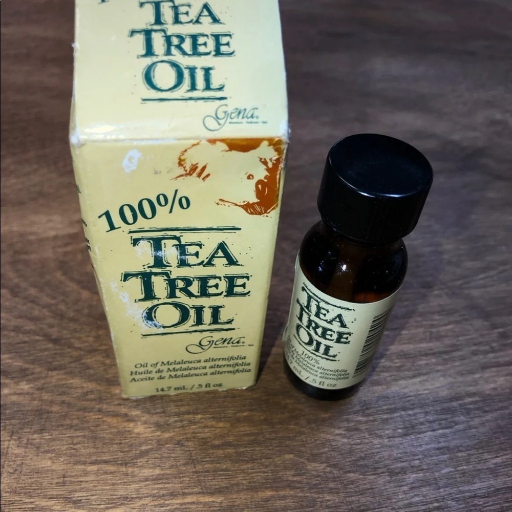 Pure tea tree oil in glass bottle